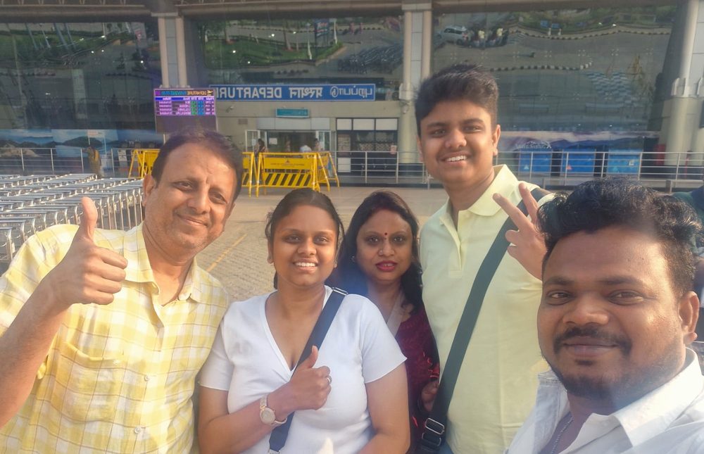Happy family at airport departure with South Moon driver