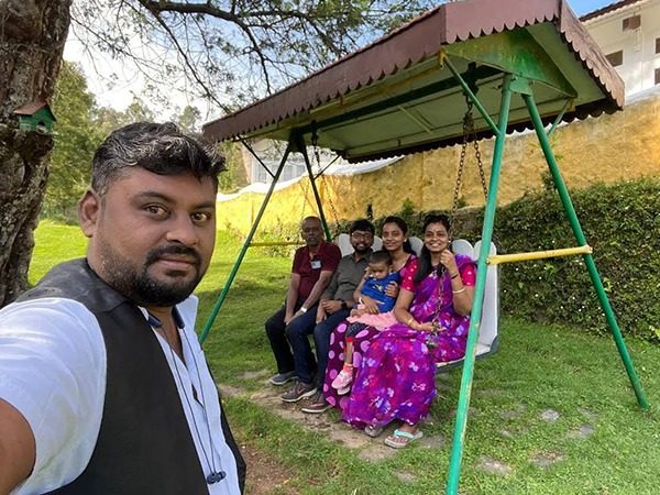 Family relaxing in a hill station garden